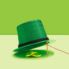 St Patrick minimal treasure concept. Striking green glittery top hat and golden coins under. Vivid...