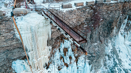 A creepy walkway at the quarry with ice forming on the wall.