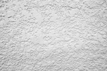 Grey background with textured pattern.