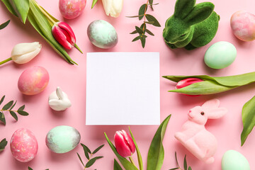 Composition with blank card, flowers and Easter eggs on pink background