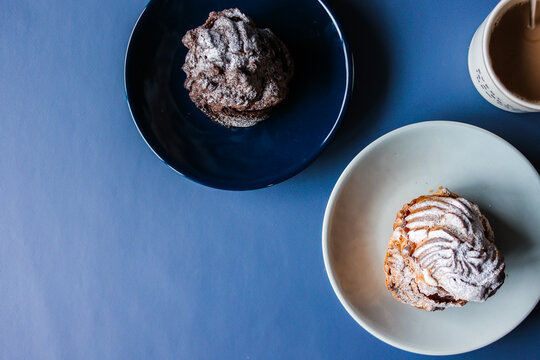 Coffee break with chocolate cream puff and original cream puff