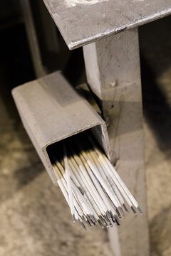 Coated electrode in a metal box at the welding table.