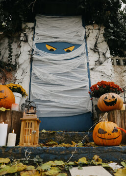 Yard entrance decorated for traditional Halloween celebration, low angle view