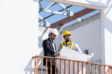 Architect and engineer foreman in helmet working on a building site,Civil engineer project construction work.