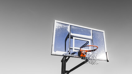 Black and white background with snow splattered backboard