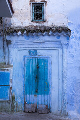 Old home in the Old Town section of Chefchaouen, Morocco, where homes, walls and steps are painted beautiful shades of blue
