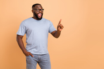 Photo of celebrate millennial beard guy indicate promo wear eyewear blue outfit isolated on beige color background