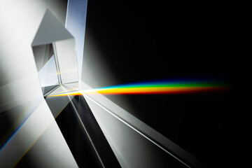 Triangular Prism dispersing sun beam splitting into a spectrum on white background - obrazy, fototapety, plakaty