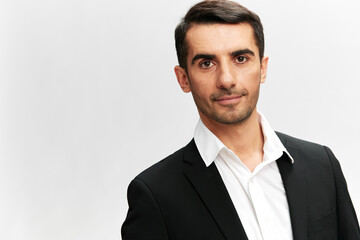 handsome man black suit close-up emotions isolated background