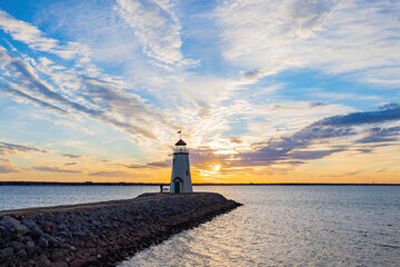 Sunset beautiful afterglow over the lighthouse of Lake Hefner