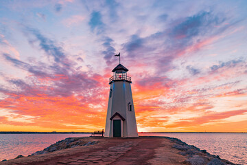 Sunset beautiful afterglow over the lighthouse of Lake Hefner - obrazy, fototapety, plakaty