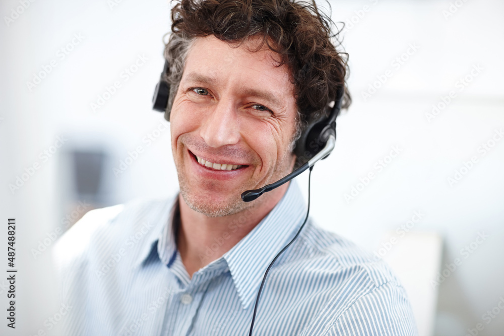 Poster what can i do for you today. cropped portrait of a handsome call center operator in the office.
