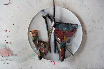 old paints are lying on the table