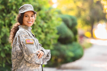 Portrait of African-American female soldier outdoors