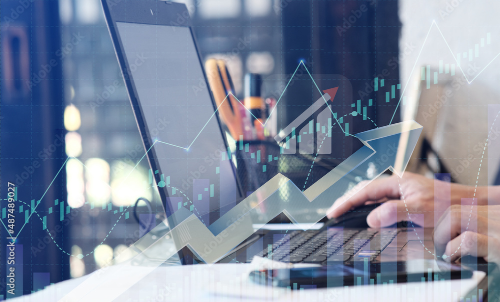 Poster double exposure of financial graph drawings and a desk with a working notebook in the background. th