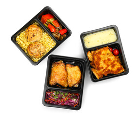 Lunch boxes with different tasty food on white background