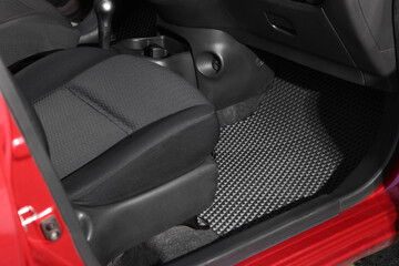 Black rubber car floor mat in auto