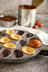 Walnut cookie mold maker on grey background, closeup