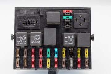 Automotive fuse block. Burnt fuse holder. The block is labeled with electrical circuits.