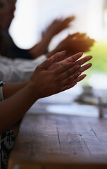 Giving praise where praise is due. Shot of a group of unidentifiable businesspeople applauding at the boardroom table.