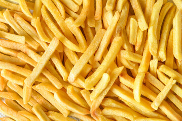 Tasty french fries as background