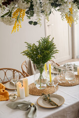 Stylish table setting with beautiful flowers in dining room