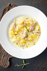 soup chicken meat vegetable broth and rice fresh healthy meal food diet still life snack on the table copy space food background rustic 