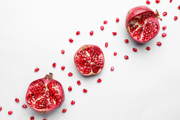 Ripe delicious pomegranate on light background