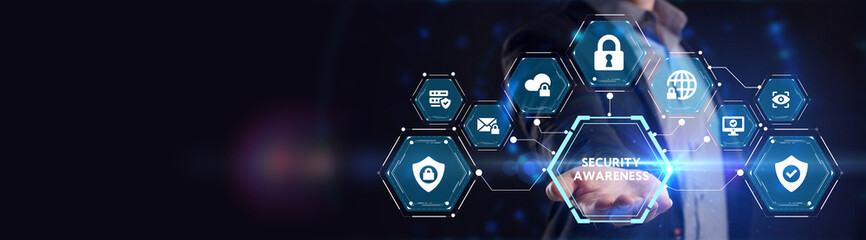 Cyber security data protection business technology privacy concept. Young businessman  select the icon Security Awareness on the virtual display. © photon_photo