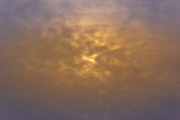 Fototapeta premium Hanging yellow clouds covered the sun.