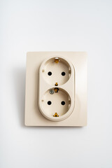 Double socket insulated on a white background. 2 sockets connected by one monolithic housing. The socket has two plug connectors, but is installed in one standard socket.