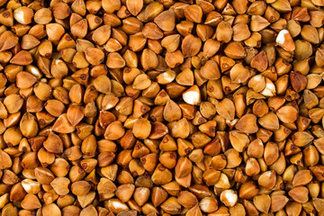 Buckwheat close-up. Texture from buckwheat grains.