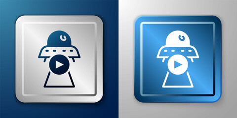 White Science fiction icon isolated on blue and grey background. Sci fi movies, popular futuristic fantasy films. Cinema category. Flying saucer, UFO. Silver and blue square button. Vector