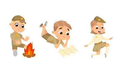 Scouting children set. Cute little boy and girl scouts in uniform warming up by fire and orienteering with map cartoon vector illustration