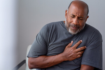 Portrait of an older senior man having chest pain. - Powered by Adobe