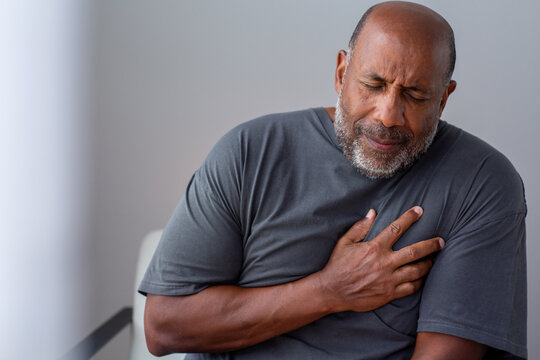 Portrait of an older senior man having chest pain.