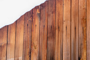Wooden wall and snow. Place for text (copy space).