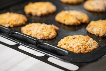 Homemade cookies with chocolate, nuts and milk on an iron tray and art background in the morning. Close. Breakfast.