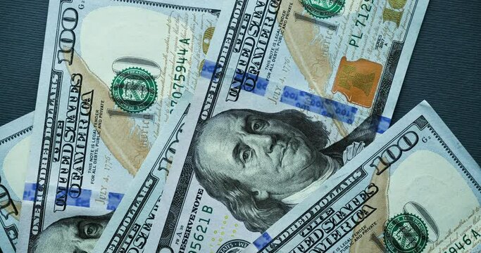 Background with American one hundred dollar bills. Looped stop motion animation