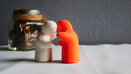 People hug on coin background.
