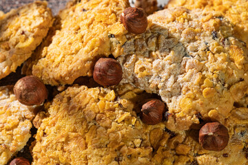 Homemade cookies with chocolate, nuts and milk on a wooden table and art background in the morning. Close. Breakfast.