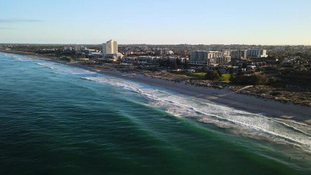 Aerial fly by of Scarborough Beach, Perth at sunrise.