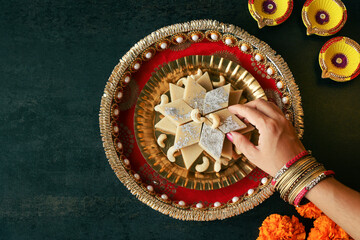 Kaju Katli Kaju Barfi Burfi cashew fudge candy woman hand serving Indian sweet mithai festival dessert Diwali Dussehra Holi ganesh chaturthi Ram navami Durga pooja Navratri Mumbai Kerala Sri Lanka