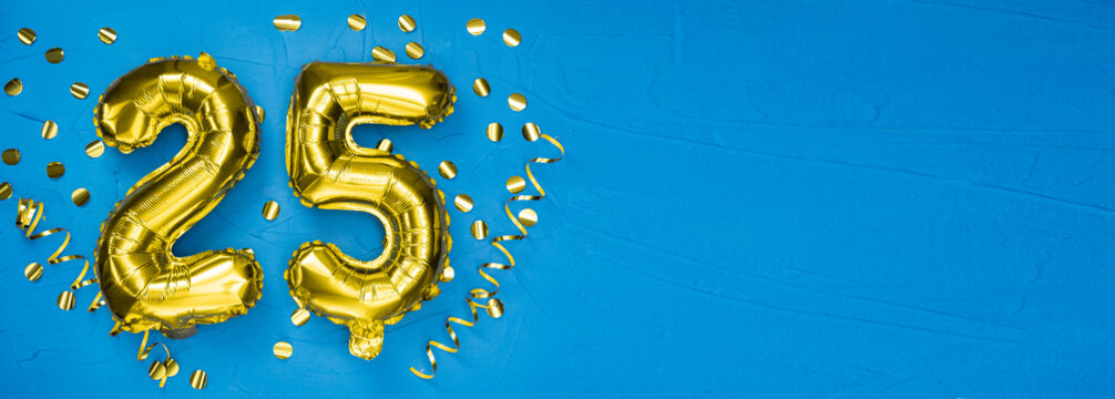 golden foil balloon number twenty five. Birthday or anniversary card with the inscription 25. blue concrete background. Anniversary celebration. Banner.