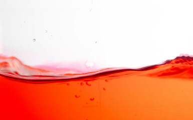 the red water splash and air bubbles on white background,Isolate picture.