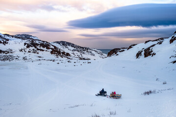 Fototapeta na wymiar Teriberka, Russia. Snowmobile ride.