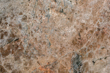 Rock texture. Stone background. Old weathered crumbling mountain surface in cracks background. Light brown rock background.