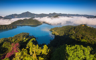 Fototapeta premium Asia culture - Beautiful landscape of lake level reflect fantasy dramatic sunrise sky in Sun Moon Lake , in Taiwan, Asia. the famous travel attractions in Nantou ,Taiwan. Scenery of Sun Moon Lake,