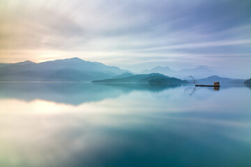 Asia culture - Beautiful landscape of lake level reflect fantasy dramatic sunrise sky in Sun Moon Lake , in Taiwan, Asia. the famous travel attractions in Nantou ,Taiwan. Scenery of Sun Moon Lake,