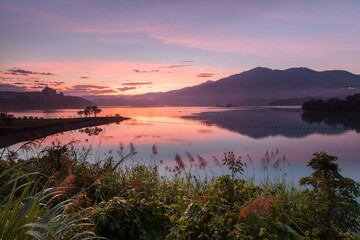 Asia culture - Beautiful landscape of lake level reflect fantasy dramatic sunrise sky in Sun Moon Lake , in Taiwan, Asia. the famous travel attractions in Nantou ,Taiwan. Scenery of Sun Moon Lake,